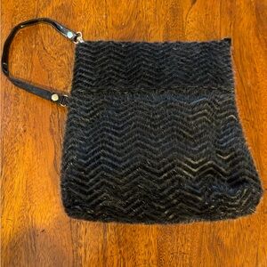 Black fuzzy faux fur wristlet. NWOT